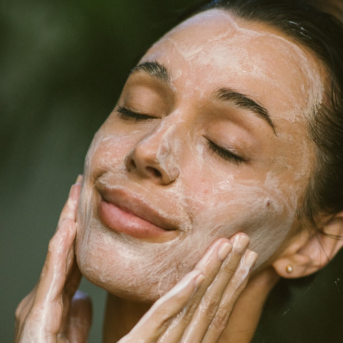 Woman applying Super Citrus Cleanser Gel Face Wash - Eco By Sonya